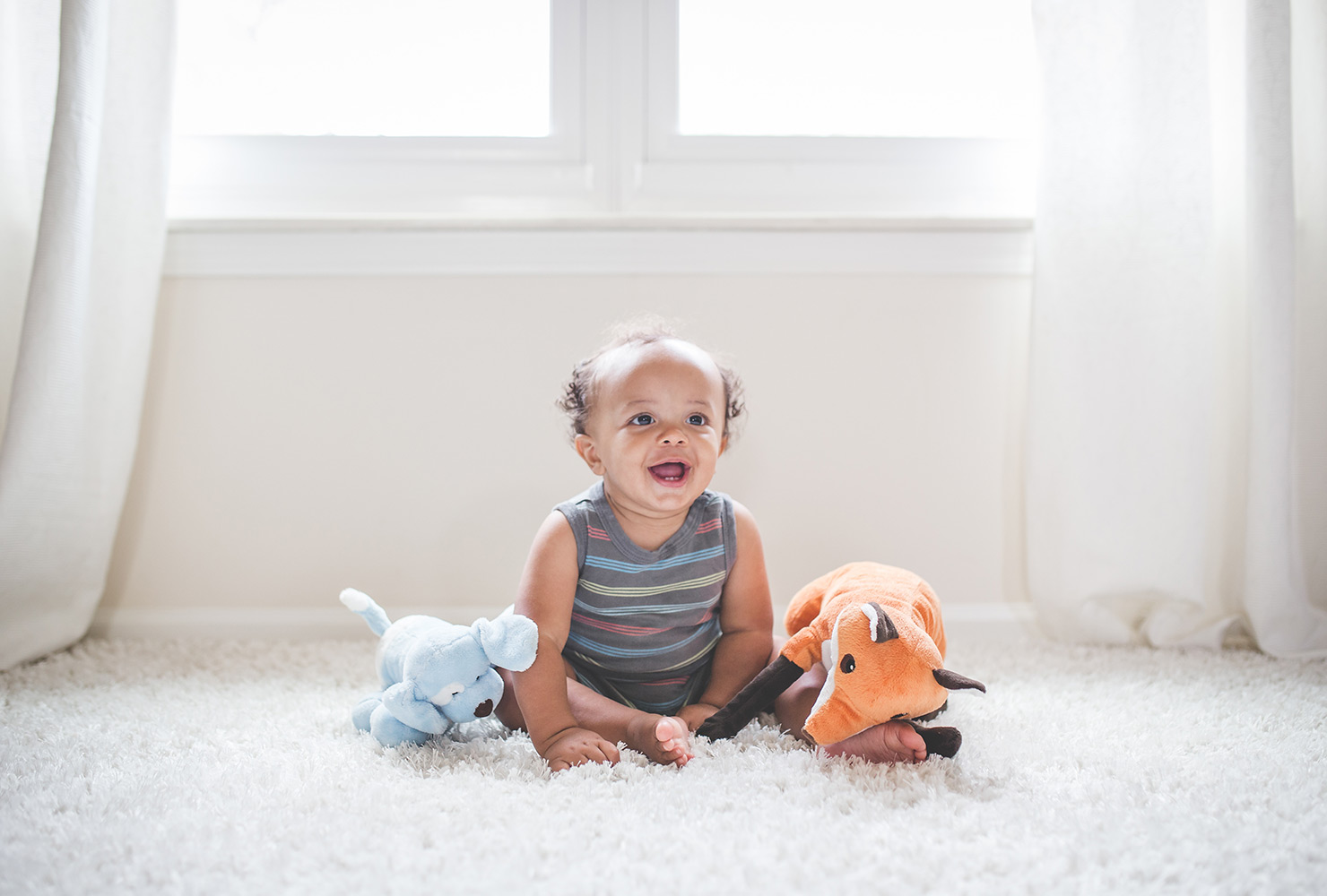 african american newborn with new toys